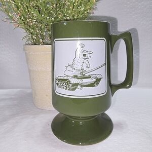 VINTAGE FOOTED MUG ARMY GREEN WITH GRAPHIC DESIGN GATOR ON ARMY TANK NOSTALGIC